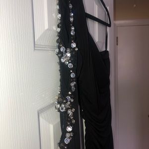 Black dress with rhinestone detailing on sleeve